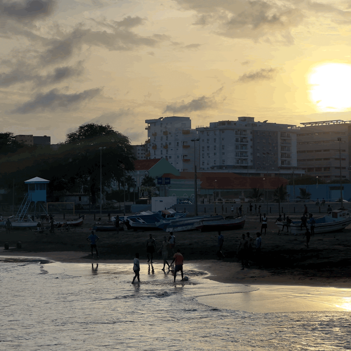 Beach and waterfront buildings in Cape Verde at sunset.