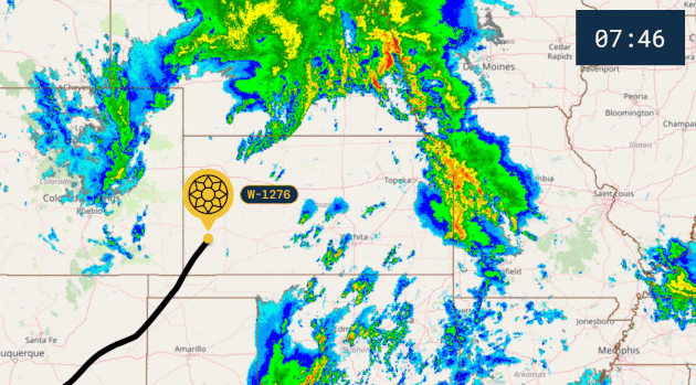 Animated radar map of a Nebraska storm, with a balloon route crossing shifting bands of heavy rain.